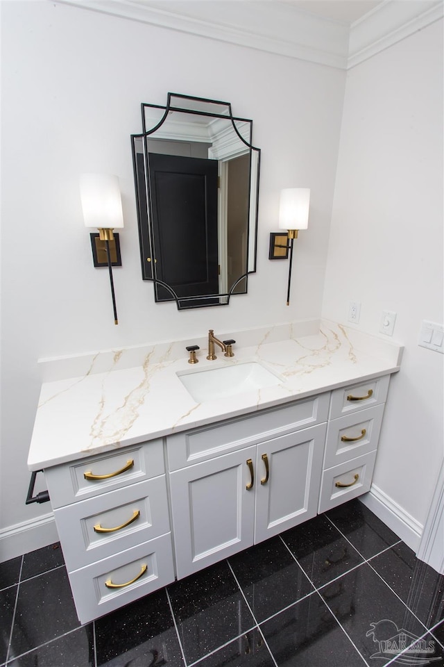 bathroom with vanity, crown molding, and tile patterned flooring