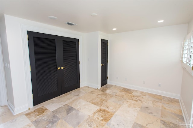 unfurnished bedroom featuring a closet