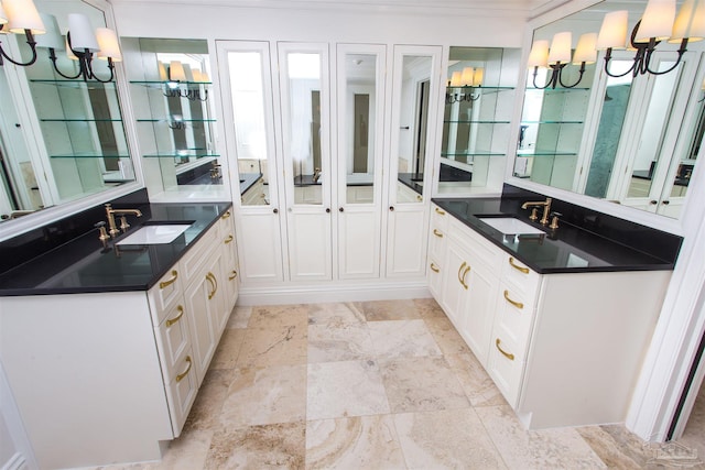 bathroom with ornamental molding and sink