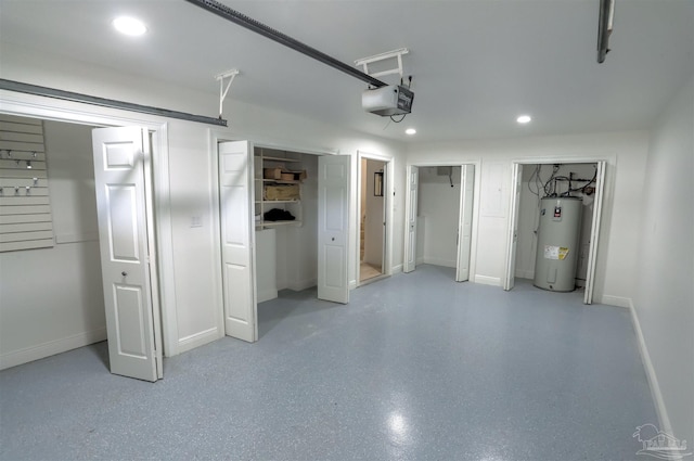 garage featuring a garage door opener and electric water heater