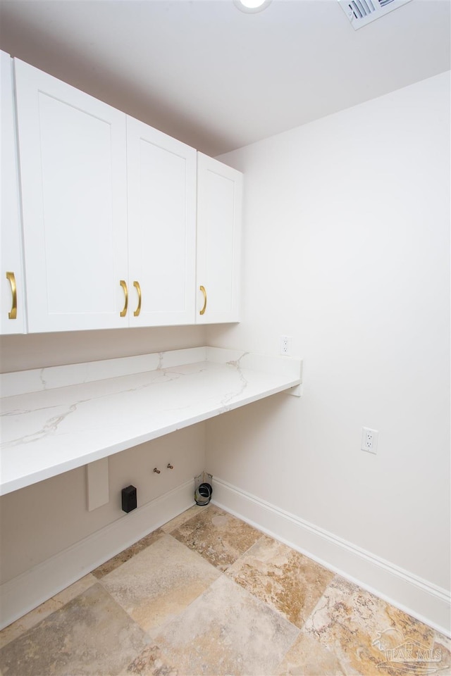 laundry room with cabinets