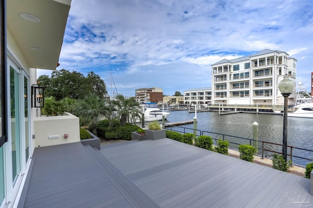 wooden terrace with a water view