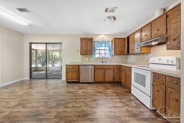 kitchen with white range with electric cooktop, dishwasher, plenty of natural light, and sink