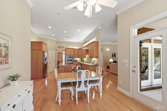 dining area with recessed lighting, light wood-style floors, crown molding, baseboards, and ceiling fan