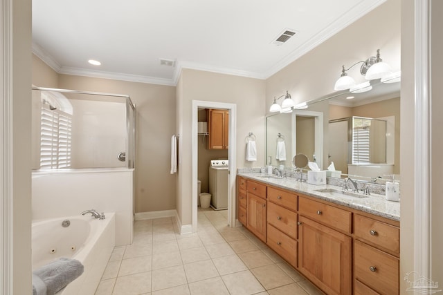 full bathroom with tile patterned flooring, visible vents, washer / dryer, and a sink