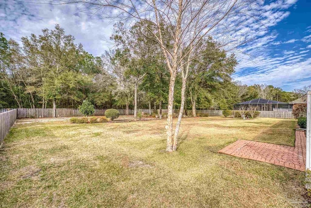 view of yard with a fenced backyard