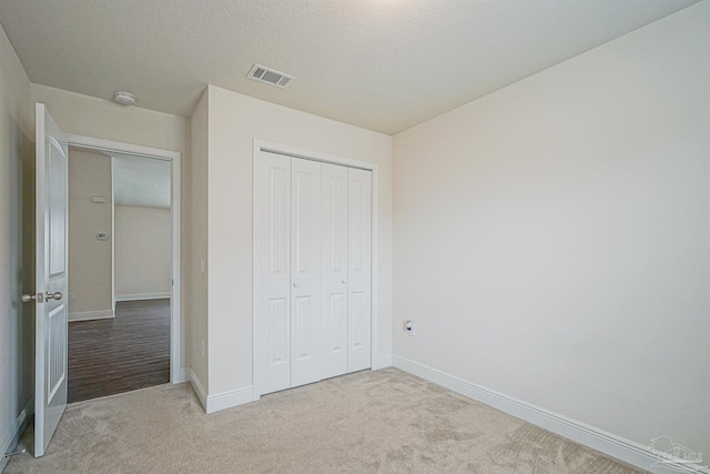 257 Millet Cir, Cantonment, FL 32533 - unfurnished bedroom with carpet flooring, baseboards, visible vents, and a closet