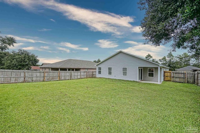 257 Millet Cir, Cantonment, FL 32533 - rear view of property featuring a fenced backyard and a yard