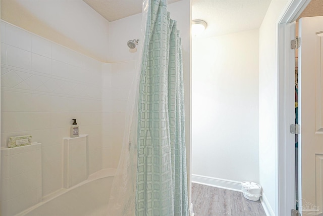 257 Millet Cir, Cantonment, FL 32533 - full bathroom featuring baseboards, wood finished floors, and a shower with curtain