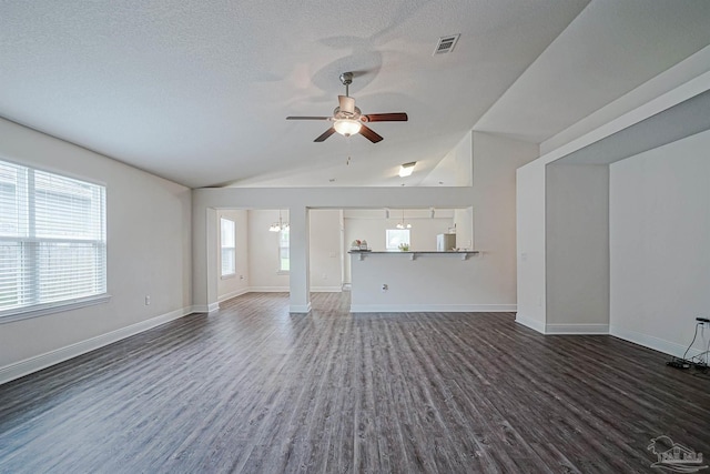 257 Millet Cir, Cantonment, FL 32533 - unfurnished living room with ceiling fan, visible vents, dark wood finished floors, baseboards, and lofted ceiling