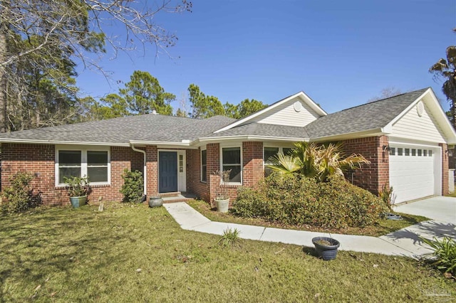 ranch-style home featuring brick siding, roof with shingles, an attached garage, and a front yard