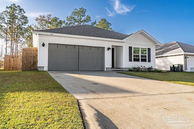 single story home with a garage and a front yard