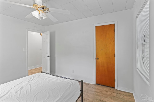 bedroom featuring ceiling fan and light hardwood / wood-style flooring