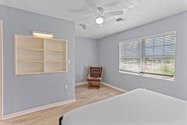 bedroom featuring light hardwood / wood-style floors and ceiling fan