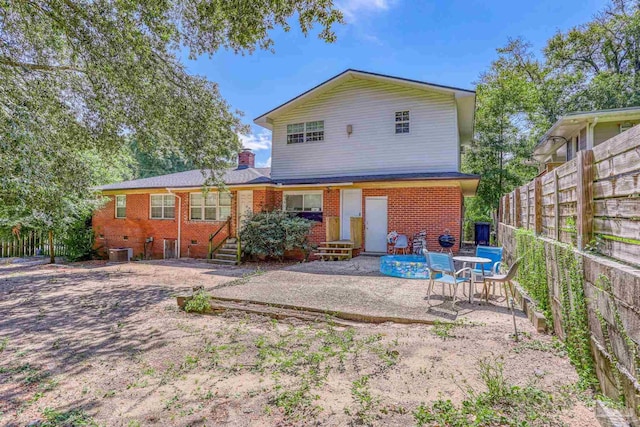 back of house featuring a patio area and central AC unit