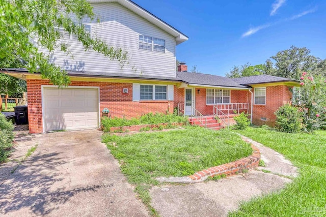 view of front of property with a garage and a front lawn