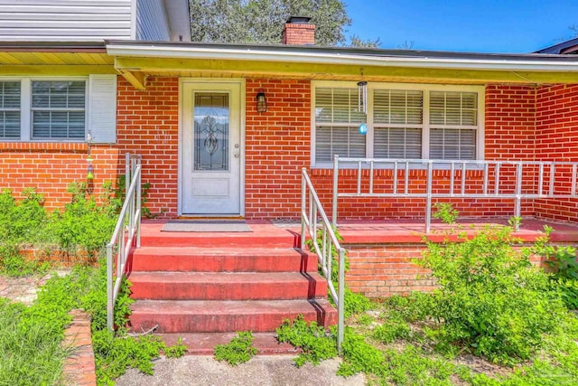 property entrance featuring a porch