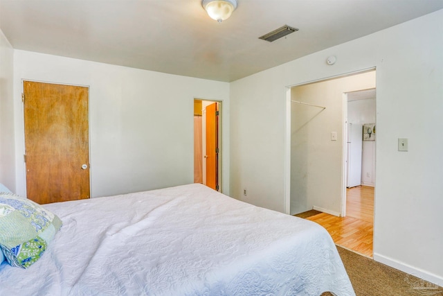 bedroom with light hardwood / wood-style flooring