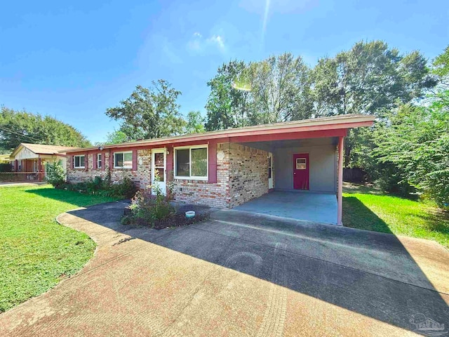 ranch-style house featuring a carport and a front yard