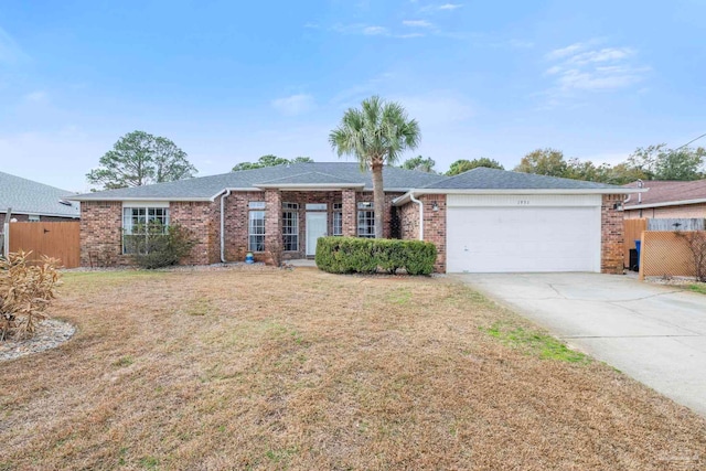 ranch-style home with a garage and a front yard