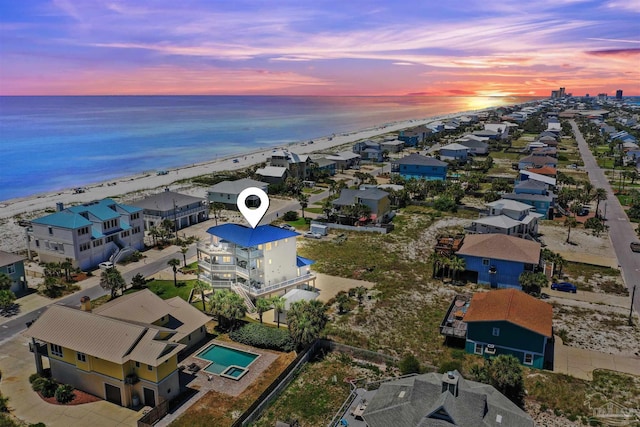 bird's eye view featuring a water view and a residential view