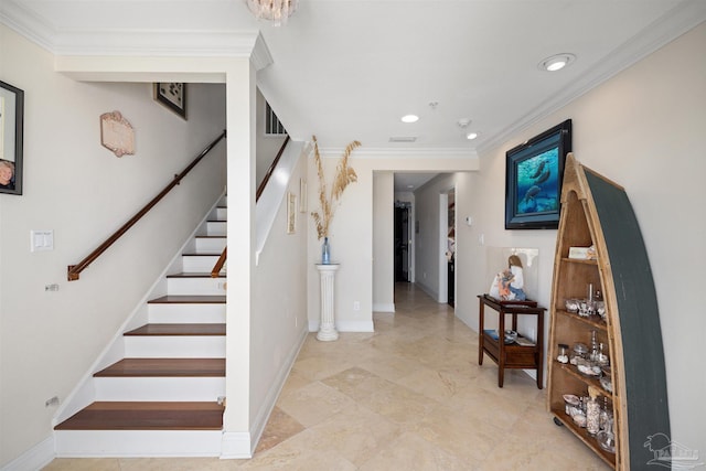 staircase featuring ornamental molding