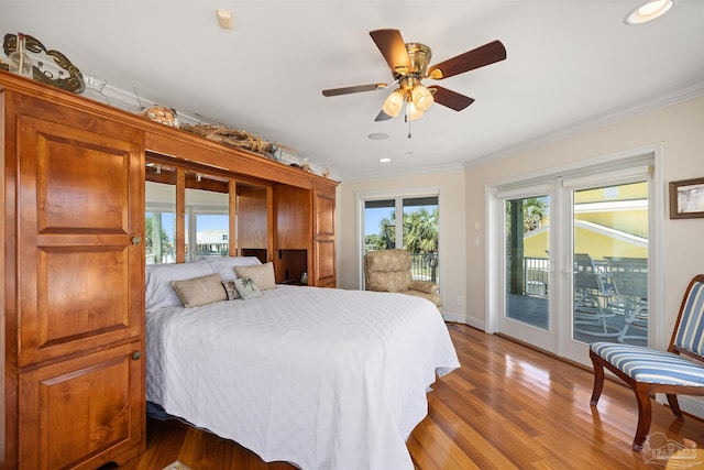 bedroom with hardwood / wood-style floors, ceiling fan, access to exterior, and crown molding