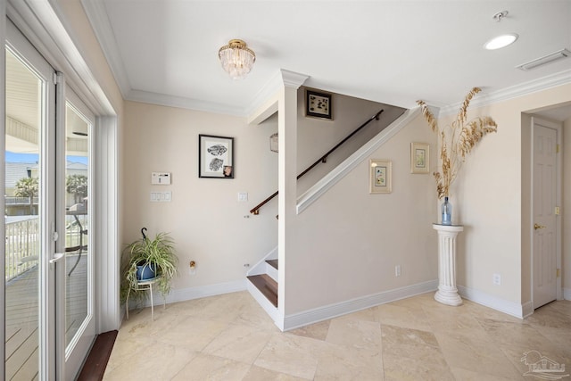 stairway with crown molding and a chandelier