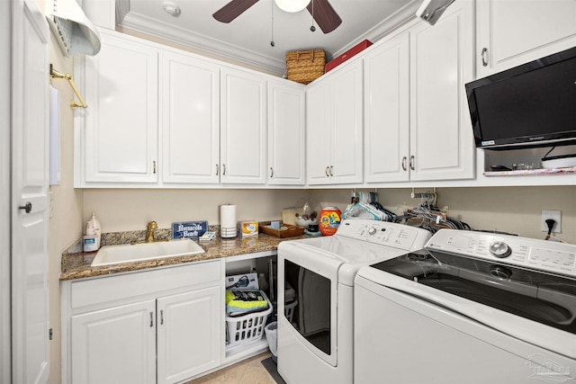 laundry area featuring ceiling fan, sink, washing machine and dryer, light tile patterned floors, and ornamental molding