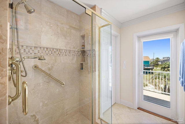 bathroom with ornamental molding and a shower with shower door