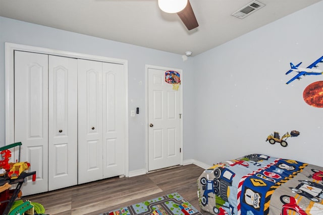 bedroom with hardwood / wood-style floors and ceiling fan