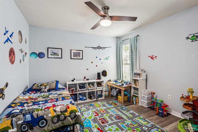 bedroom with ceiling fan and wood-type flooring