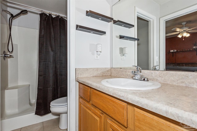 bathroom featuring ceiling fan, walk in shower, tile patterned flooring, toilet, and vanity