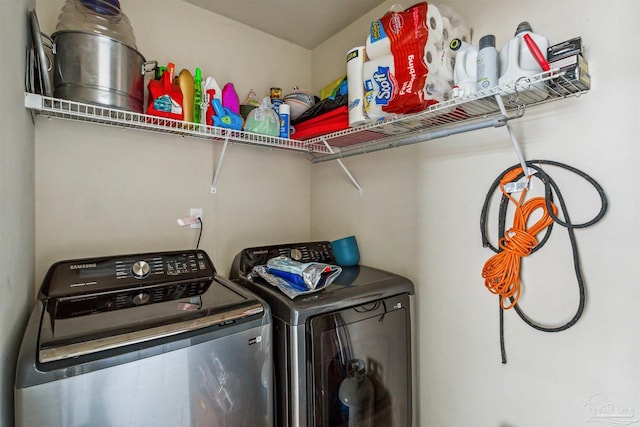 clothes washing area featuring washer and dryer