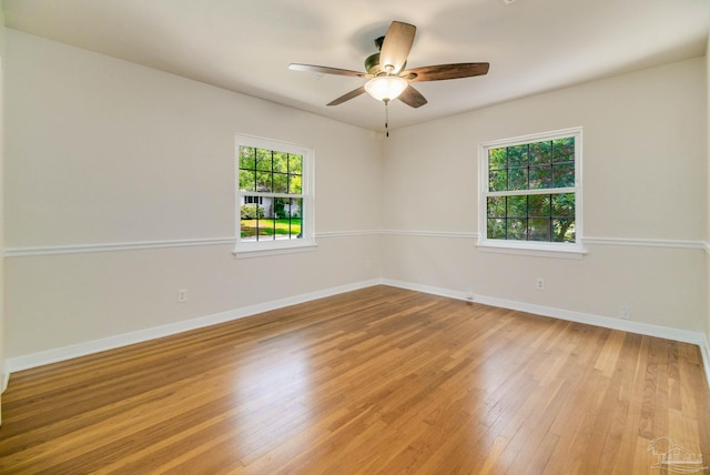 unfurnished room featuring light hardwood / wood-style floors and ceiling fan