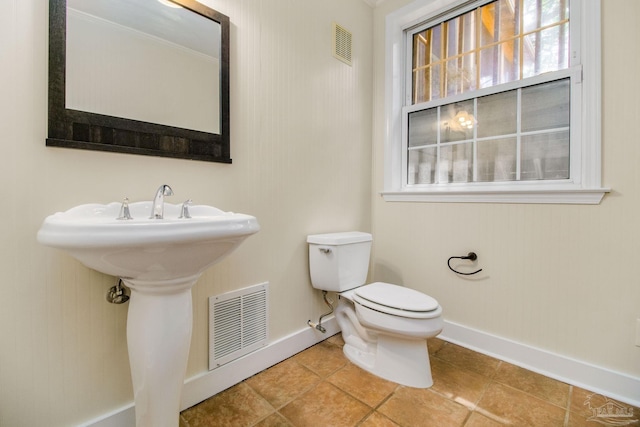 bathroom with tile patterned floors and toilet