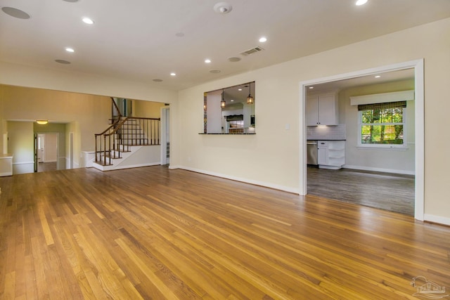 unfurnished living room featuring light hardwood / wood-style flooring