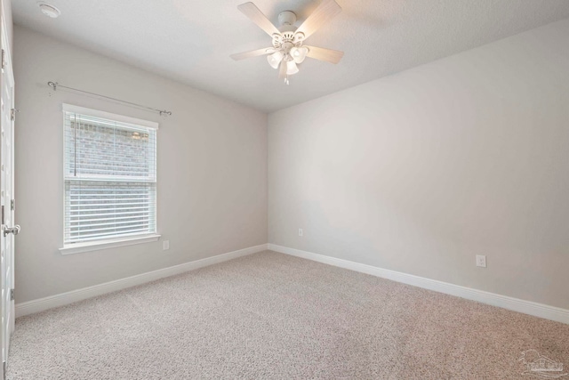 7708 Burnside Loop, Pensacola, FL 32526 - spare room with carpet flooring, ceiling fan, and baseboards