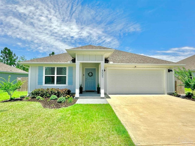 single story home featuring a front lawn and a garage