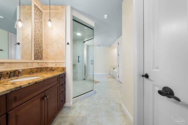 bathroom featuring vanity, separate shower and tub, and tile patterned floors