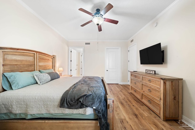 bedroom with ornamental molding, ceiling fan, and light hardwood / wood-style floors