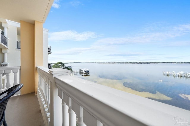 balcony featuring a water view