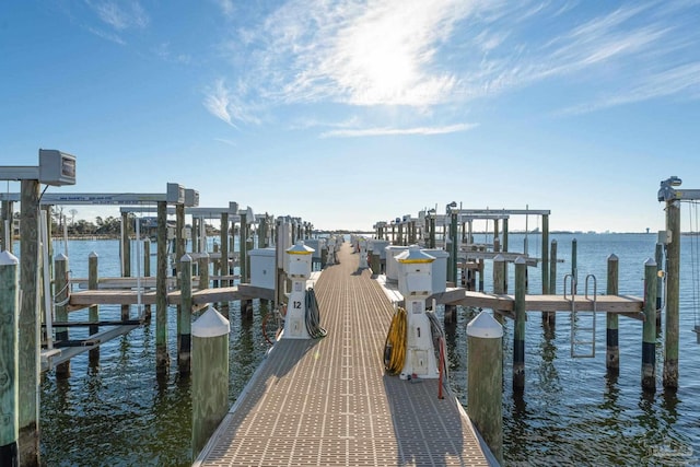 dock area featuring a water view