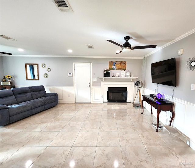 living room featuring crown molding and ceiling fan