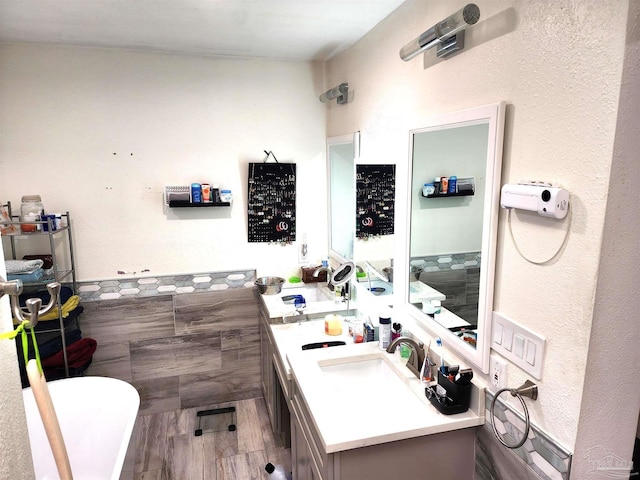 bathroom featuring a bathtub, wood-type flooring, and vanity