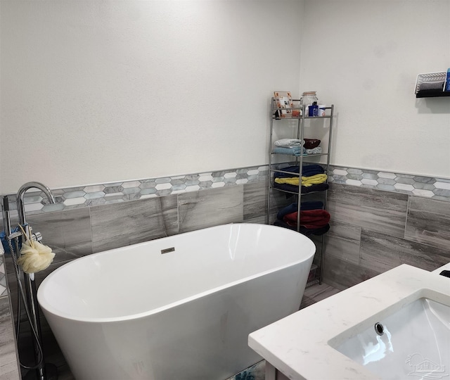 bathroom featuring tile walls and a bathtub