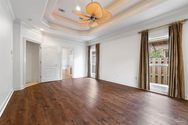 unfurnished room with crown molding, hardwood / wood-style flooring, a tray ceiling, and ceiling fan