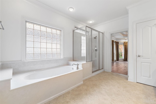 bathroom featuring crown molding and separate shower and tub