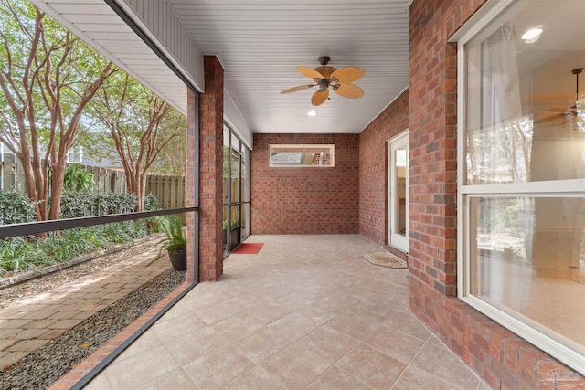 sunroom / solarium with ceiling fan