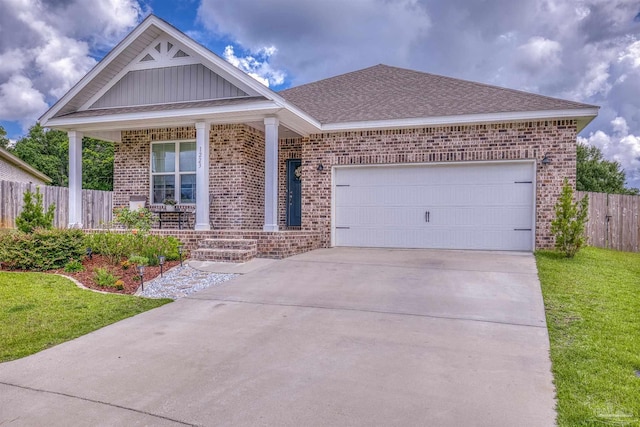 1223 Fenwick Ct, Cantonment, FL 32533 - view of front of property featuring brick siding, covered porch, concrete driveway, and an attached garage